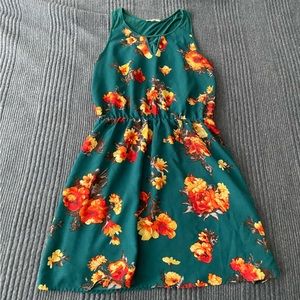 Green and floral patterned sleeveless dress